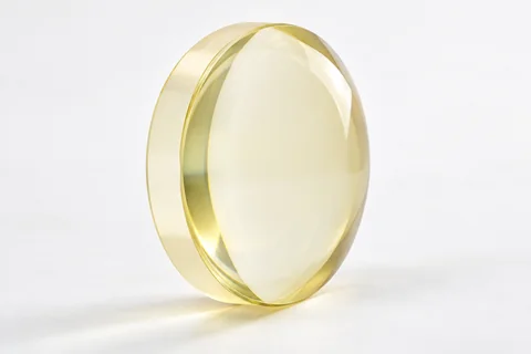 Zinc sulfide optical lens on a neutral background