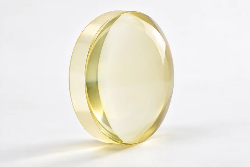 Zinc sulfide optical lens on a neutral background